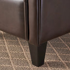 Fauteuil club capitonné en cuir reconstitué marron
