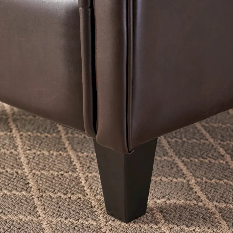 Fauteuil club capitonné en cuir reconstitué marron