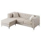 Aksamitna sofa pikowana z odwracalnym szezlongiem